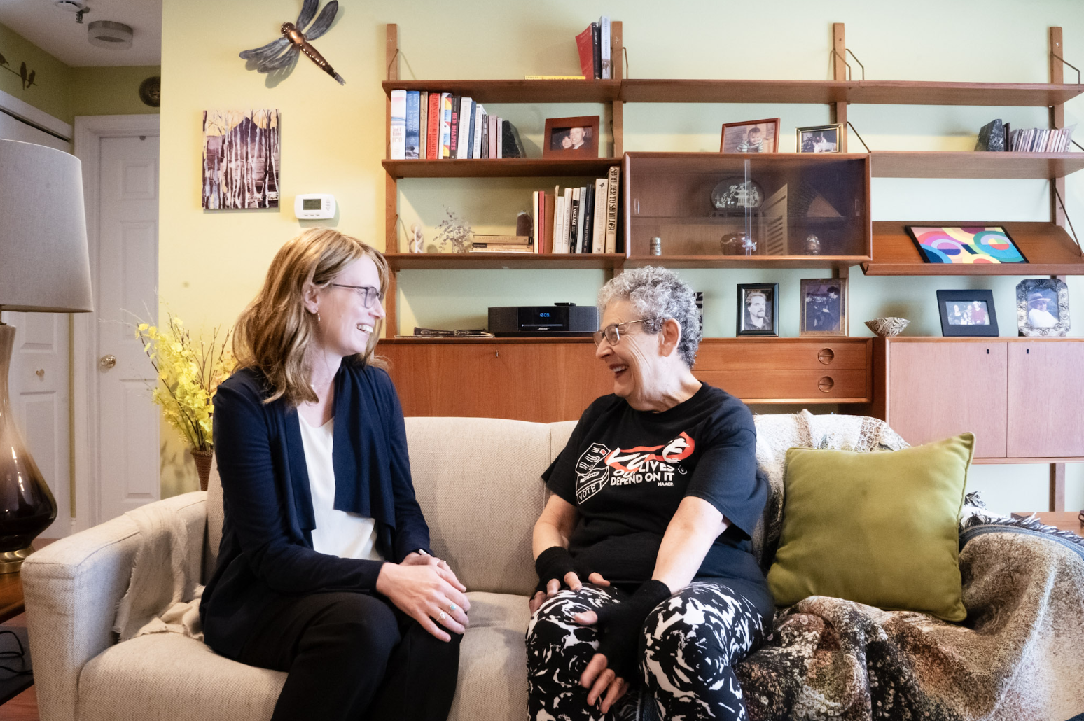 Christine Barber visiting with an older constituent at home