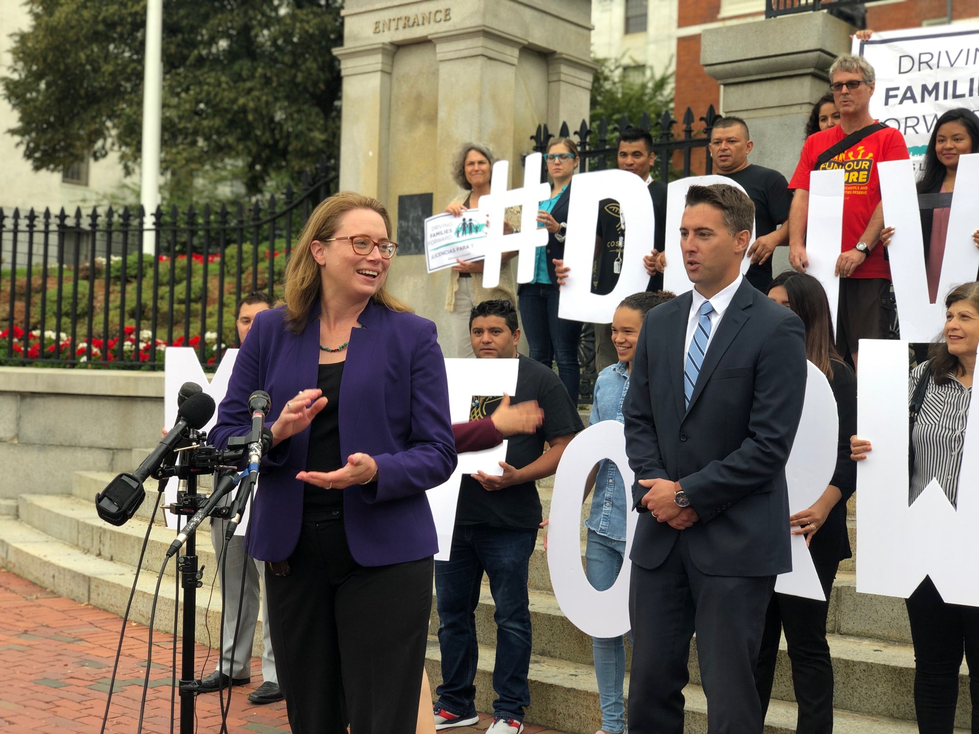 Christine Barber speaking at the Driving Families Forward press conference outside the State House