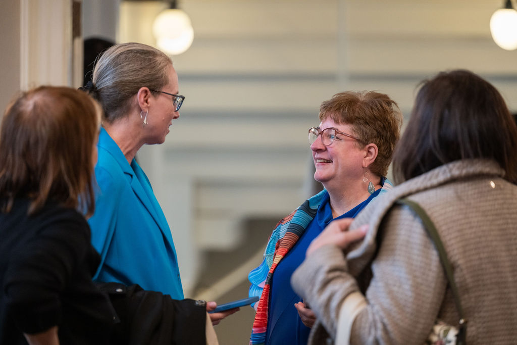 Christine Barber listening to constituents at a community event